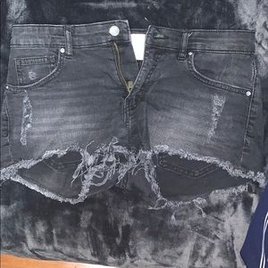 Black ripped shorts